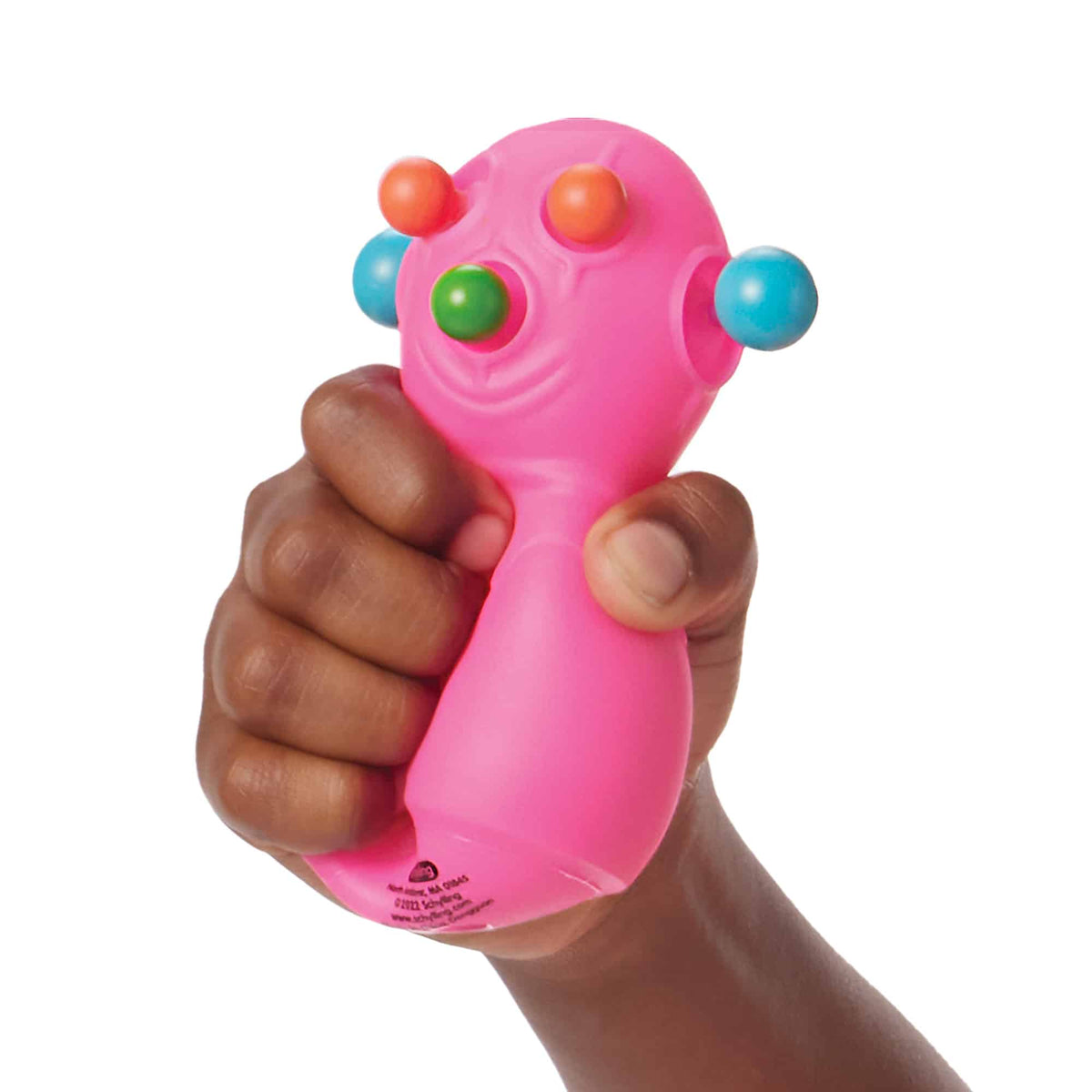 Front view of a child&#39;s hand squeezing the pink Panic Pete Nee Doh.