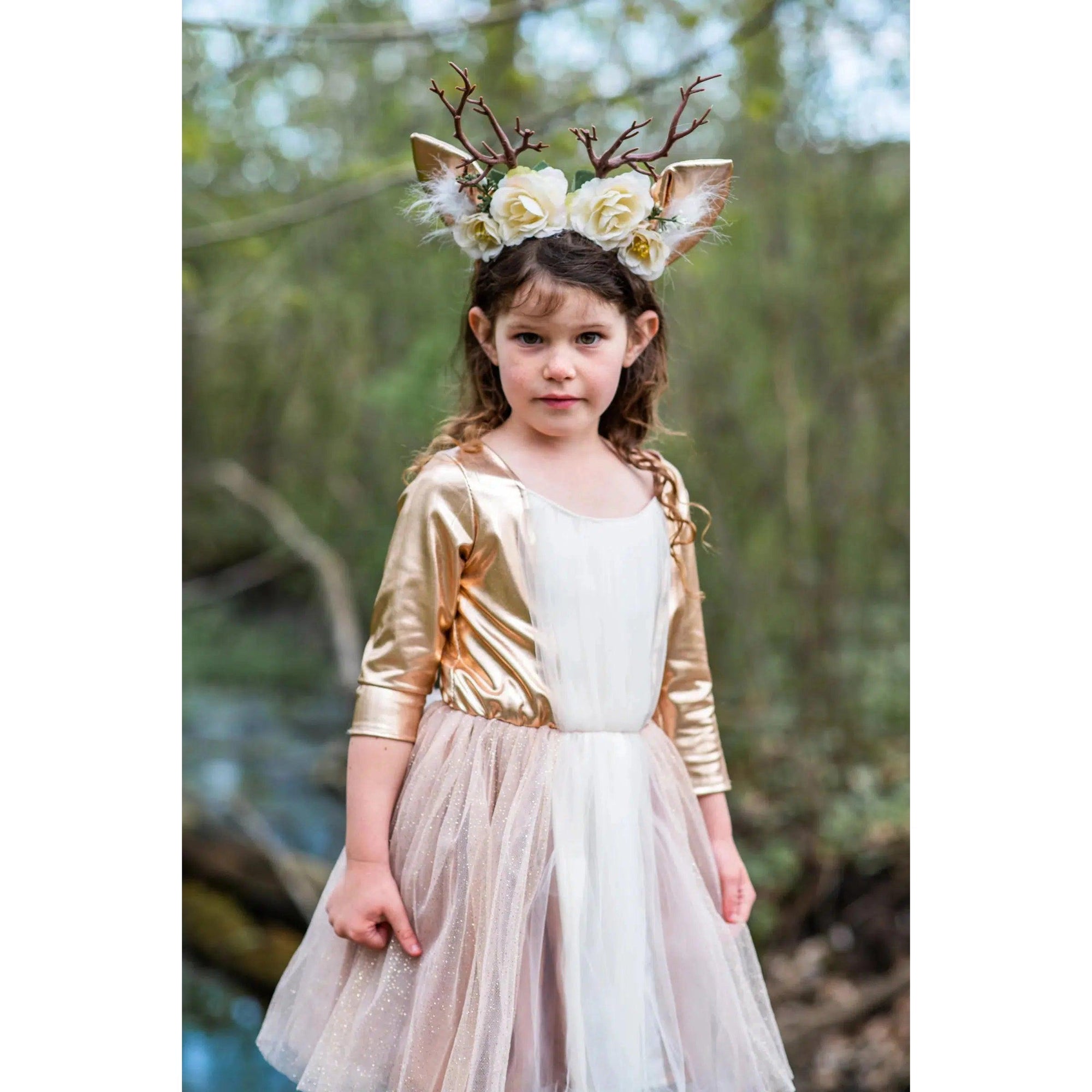Girl on a bridge with skirt fanned out, wearing deer costume.