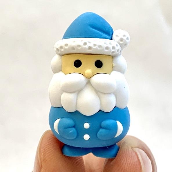 Front view of the blue santa being held from the Puzzle Eraser-Multi-Colored Santa Claus.