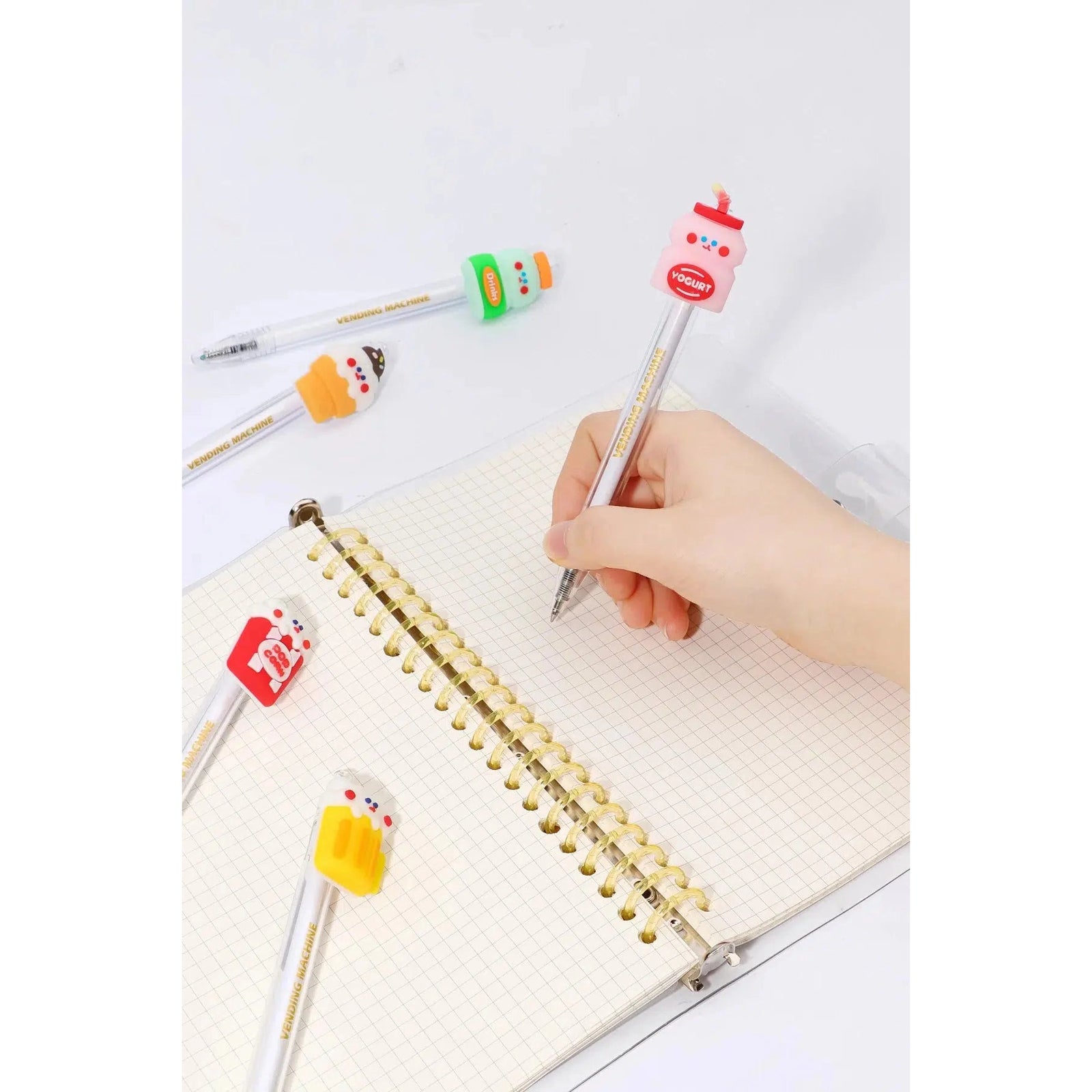 Front view of the assorted styles of the 24-Hour Snack Shop Retractable Pen including the beer, drink, yogurt, ice cream cone, pop corn and cola.