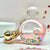 Front view of the pink Key Charm-Kitty Perfume Bottle Floaty.