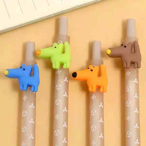 Front view of the different colors of the Gel Pen Retractable Puppy Dog including blue, green, orange, and brown laying flat on a table.