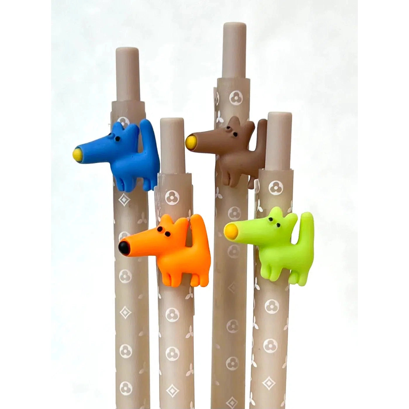 Front view of all colors of the Gel Pen-Retractable Puppy Dog blue, orange, brown, and green.