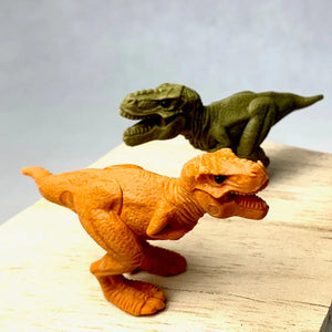 Front view of both orange and green T Rex Dinosaur Eraser.