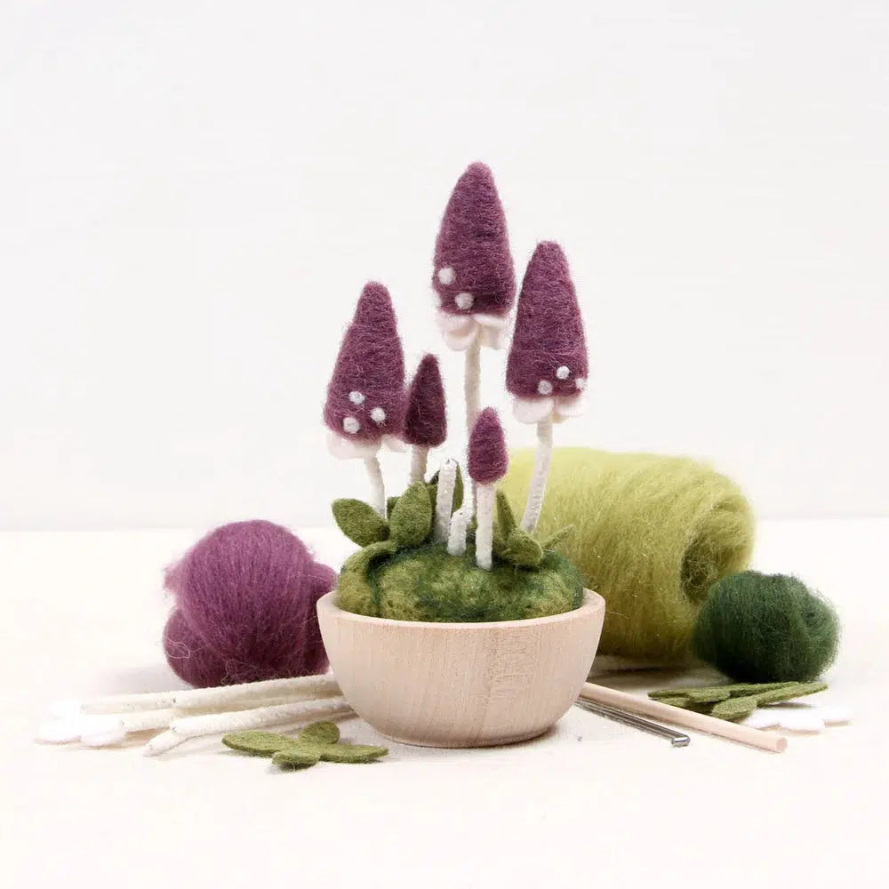 Front view of a person's hands putting together the Needle Felting Pixie Parasol kit.