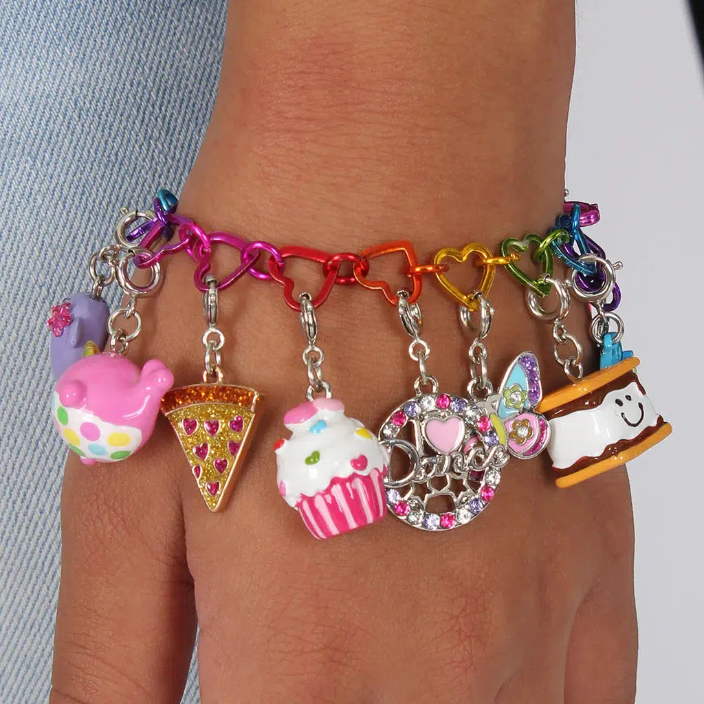 Front view of a person wearing a charm bracelet with the Charm It-Glitter Pizza Charm on it.