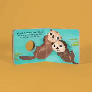 Front view of Baby Otter Finger Puppet book featuring baby otter being taught how to groom.