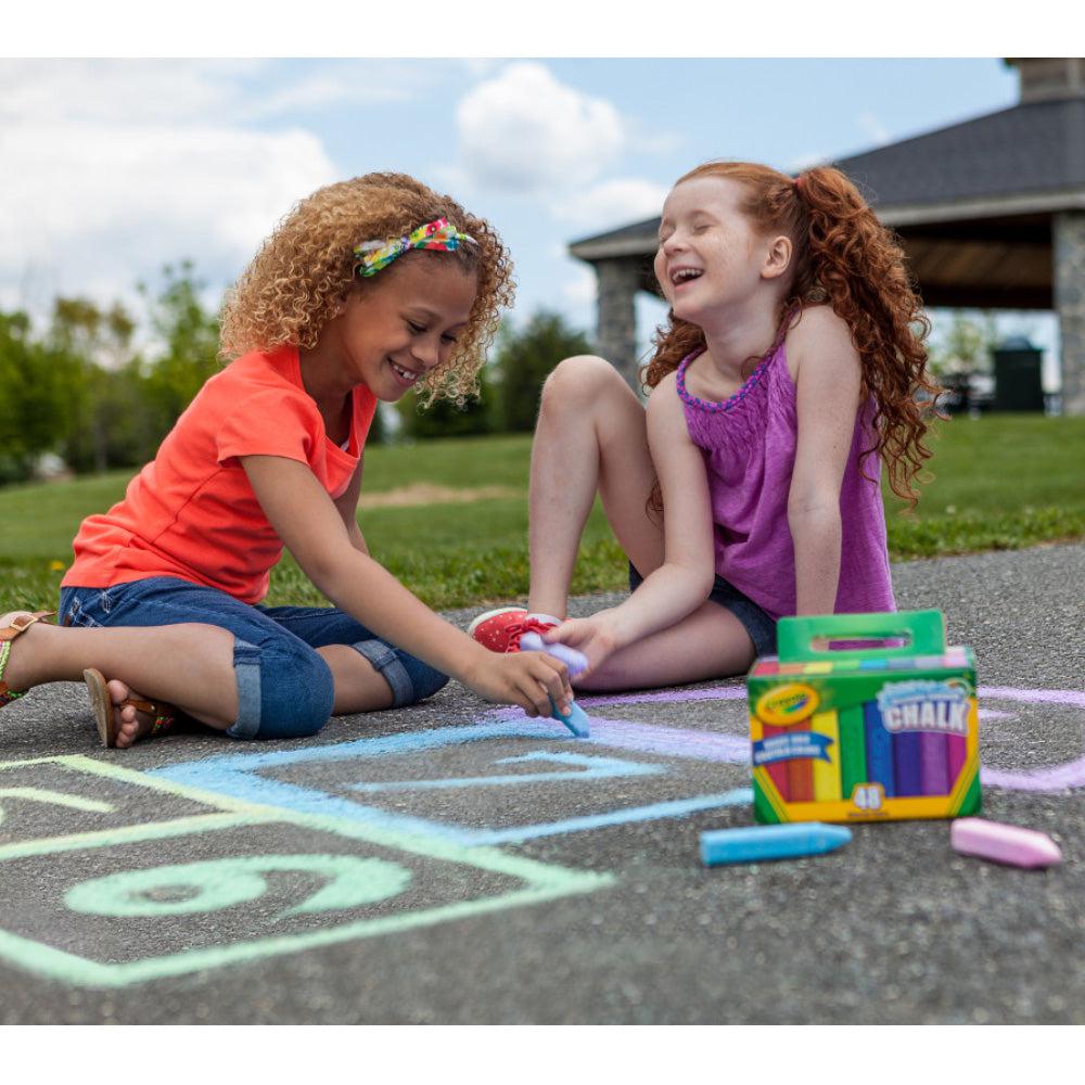Front view of two young girls drawing with Sidewalk Chalk with Tropical Colors.