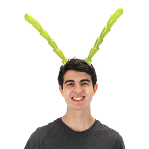 Front view of a man wearing the Light-Up Green Insect Antennae Lumen Horns.