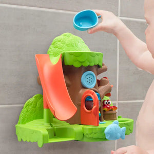 Front view of a child in a tub playing with the Timber Tots Bathtub Bay.