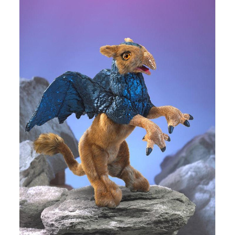 Front view of a poster showing the Griffin-Puppet standing on rocks.