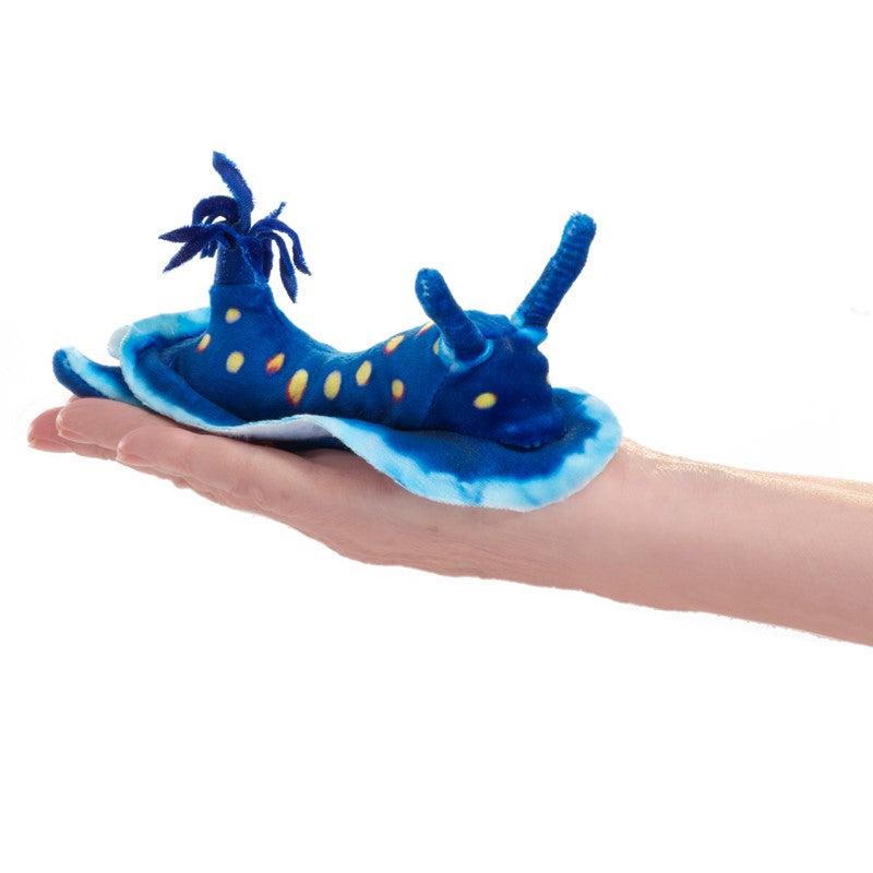 Front view of a person holding the Mini Nudibranch-Blue-Finger Puppet.