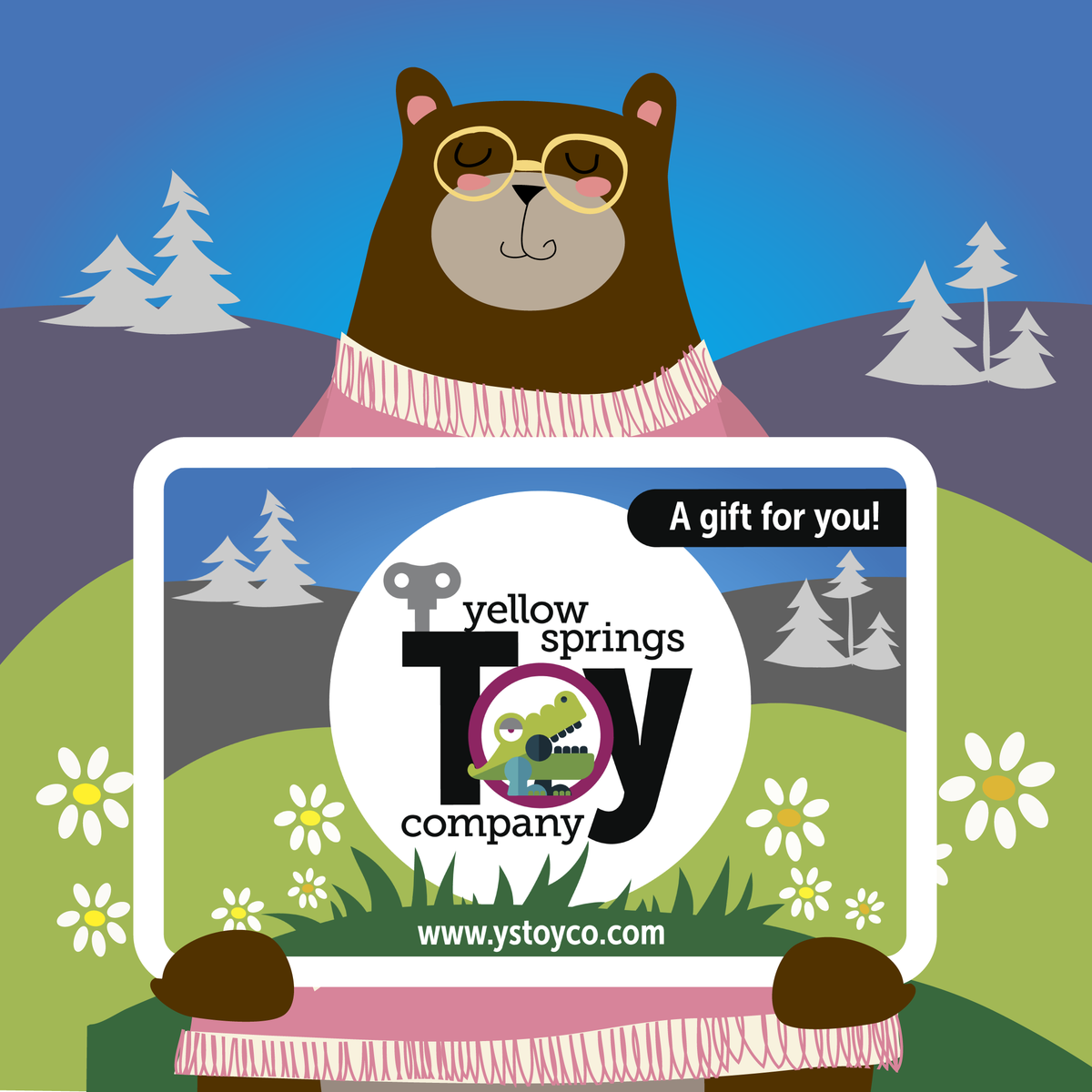 An illustration of a brown bear with glasses holding a Yellow Springs Toy Company Gift Card