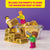 Front view of an inside page from LEGO Minifigure Photography kit showing figures by a candy dish.