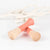 Front view of coral Wooden Jump Rope.
