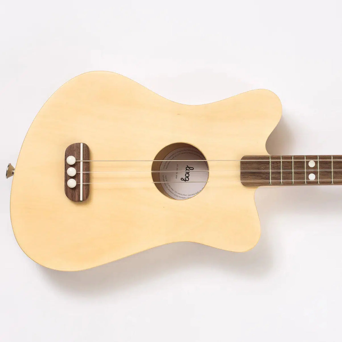 Front view of the natural guitar turned sideways against a white background.