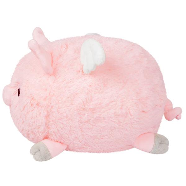 Front view of Mini Flying Piglet-7 Inch in a person's hand.