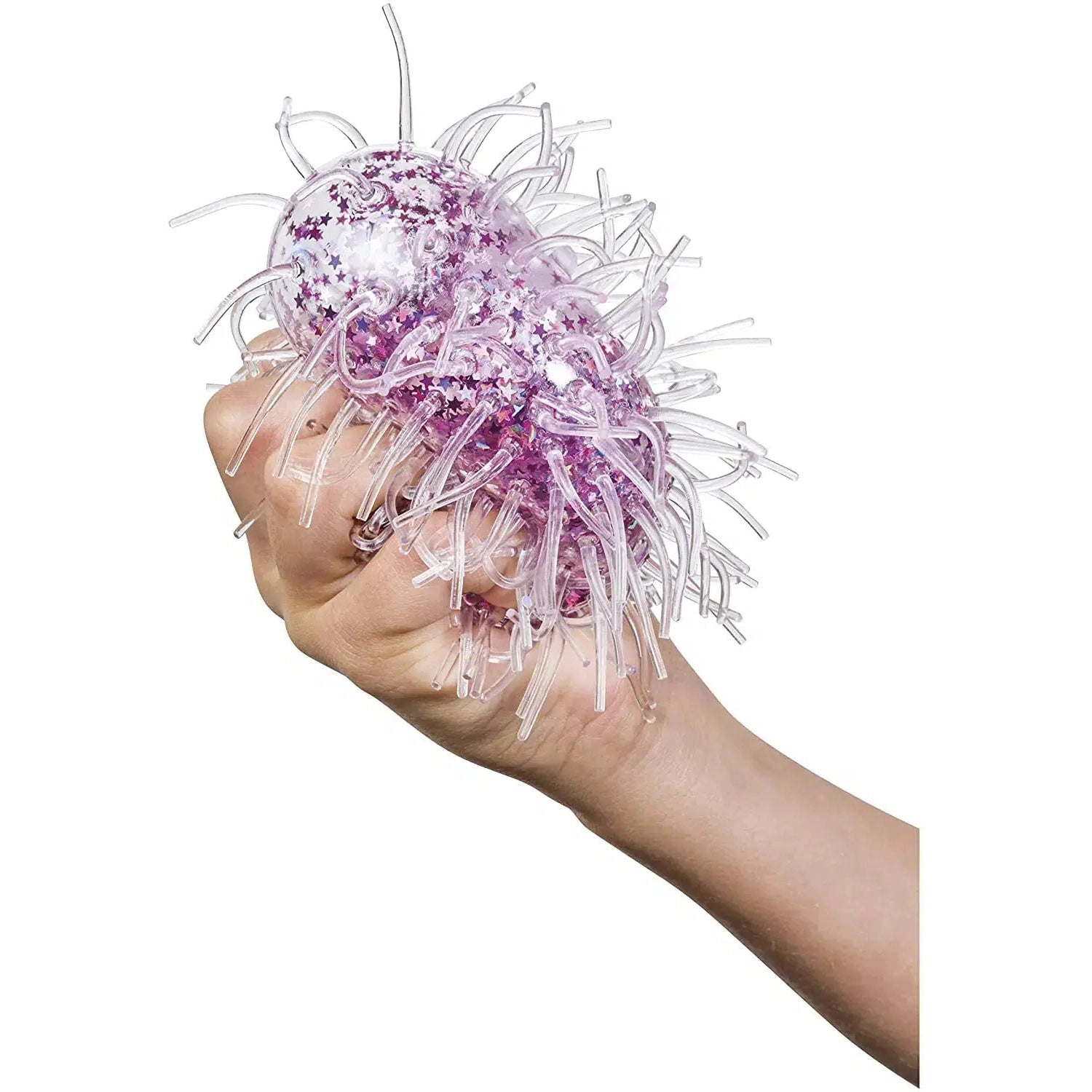 Front view of purple Sea Anemone in a person's hand the is squeezing it.