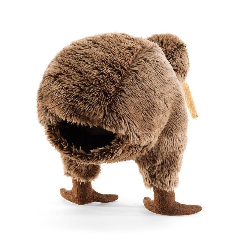Brown plush animal with a fluffy body and small legs on a white background