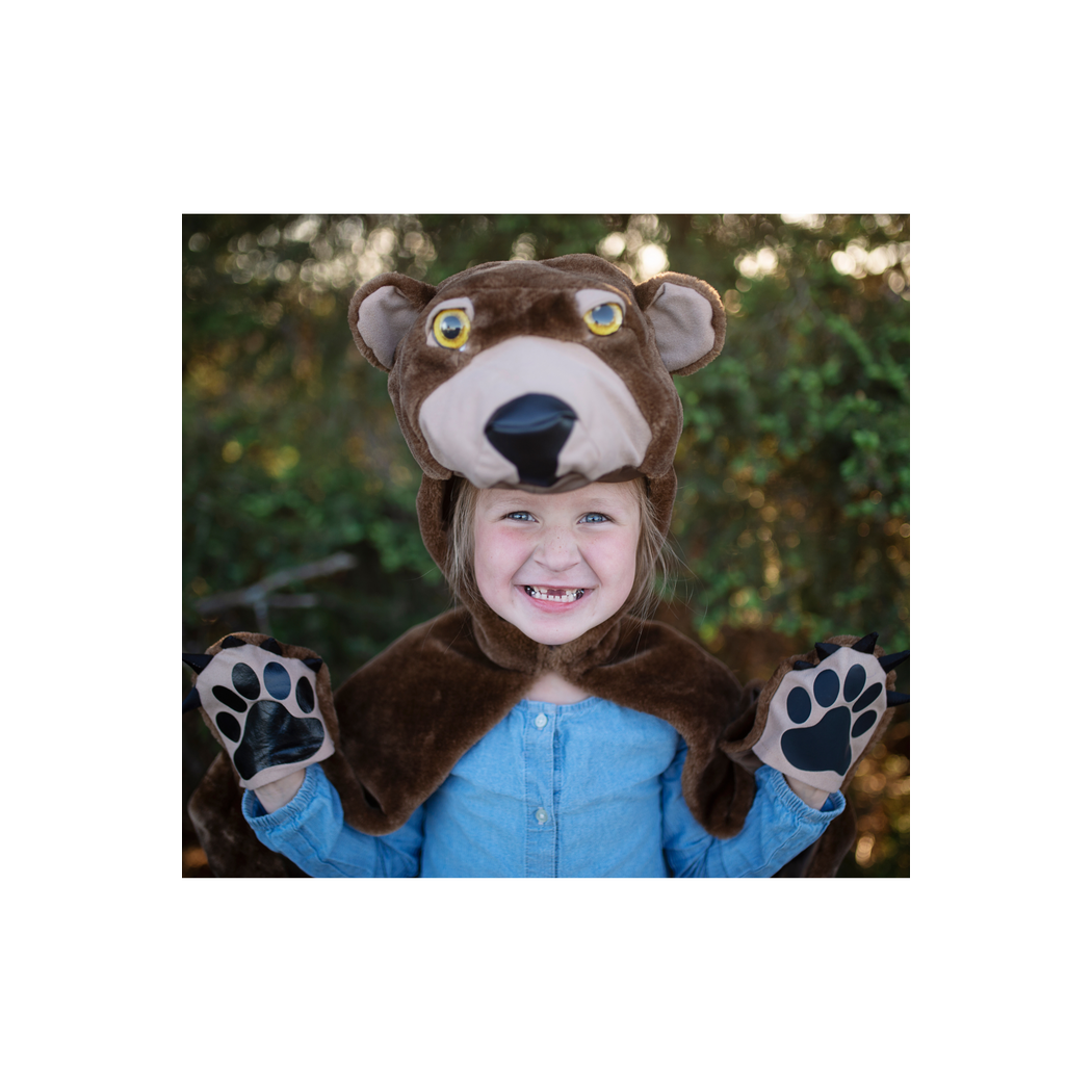Alternate view child with bear hood up and bear paws on her hands