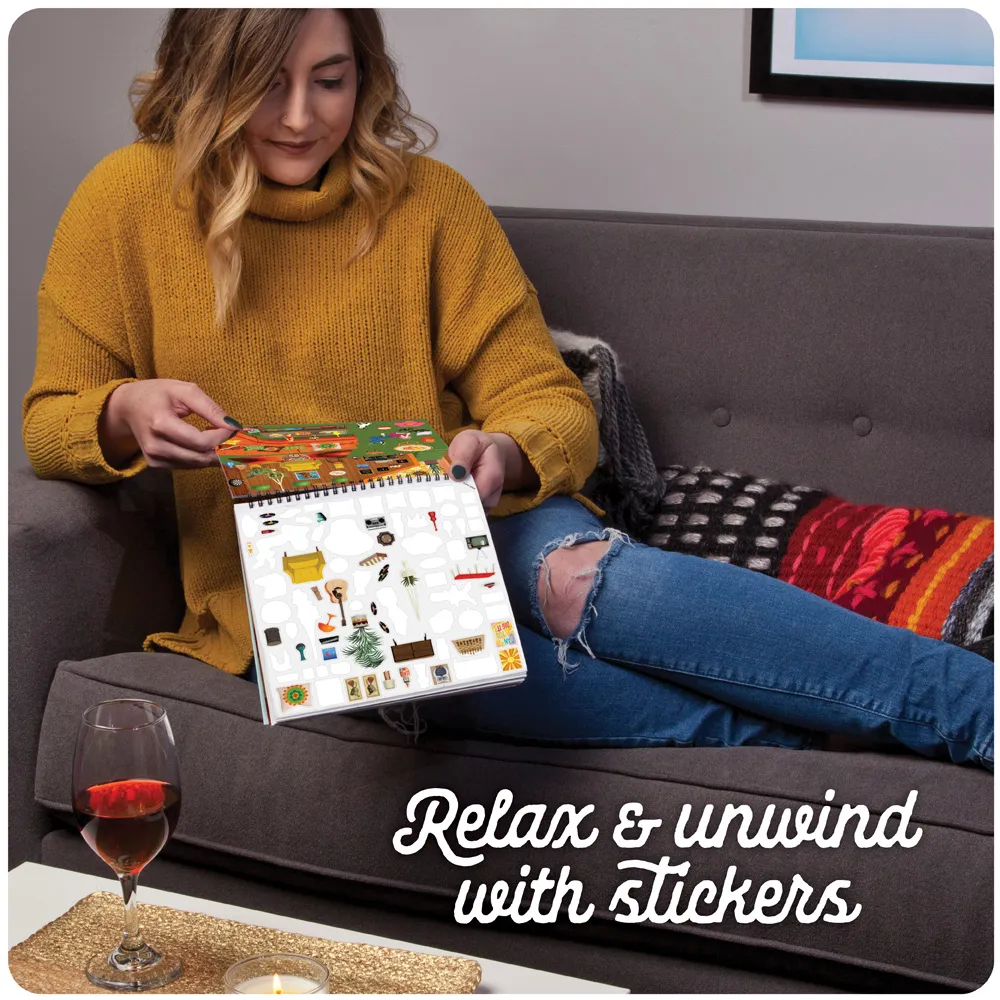 Woman lounging on the couch with her sticker book and a glass of wine