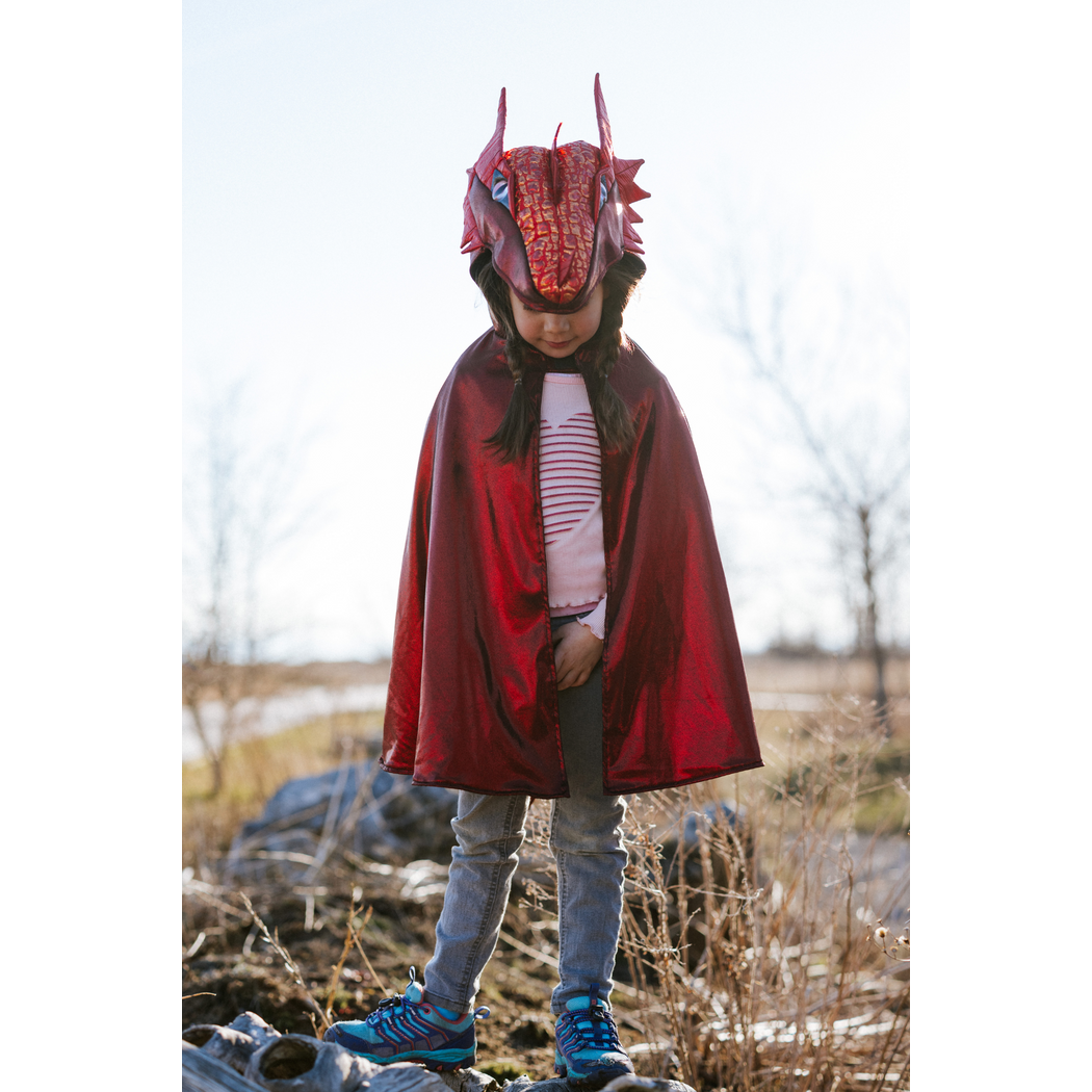 Child wearing the dragon cape with hood on