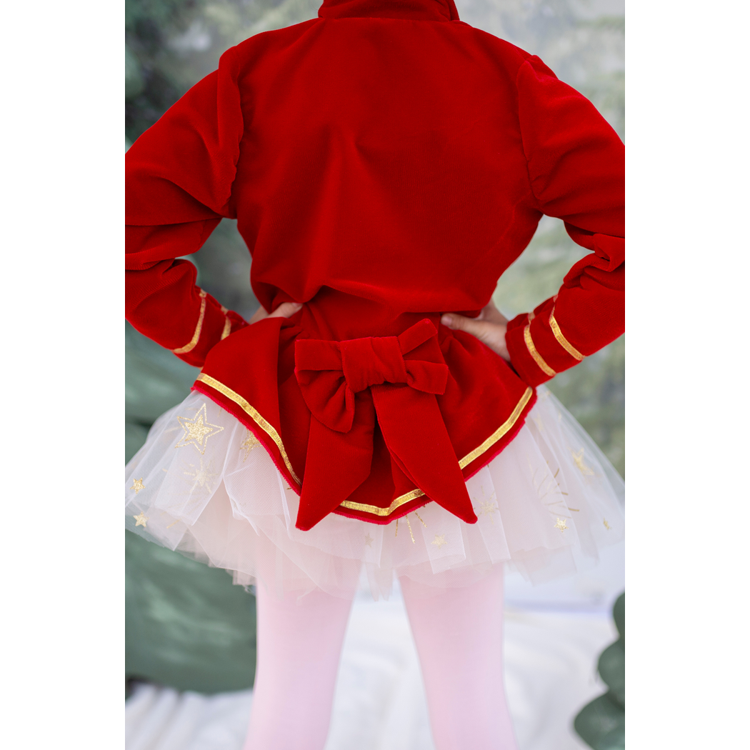 Child wearing jacket, back detail view of bow