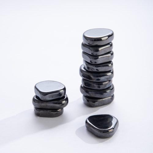 Front view of stacks of Metallic SuperStones-5 Per Bag.