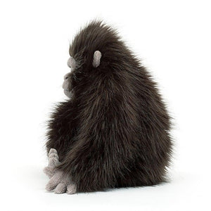 Side view of Gomez Gorilla against a white background.