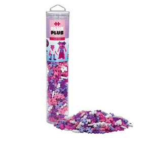 Plus Plus tube container and pile of multicolor glitter plus plus