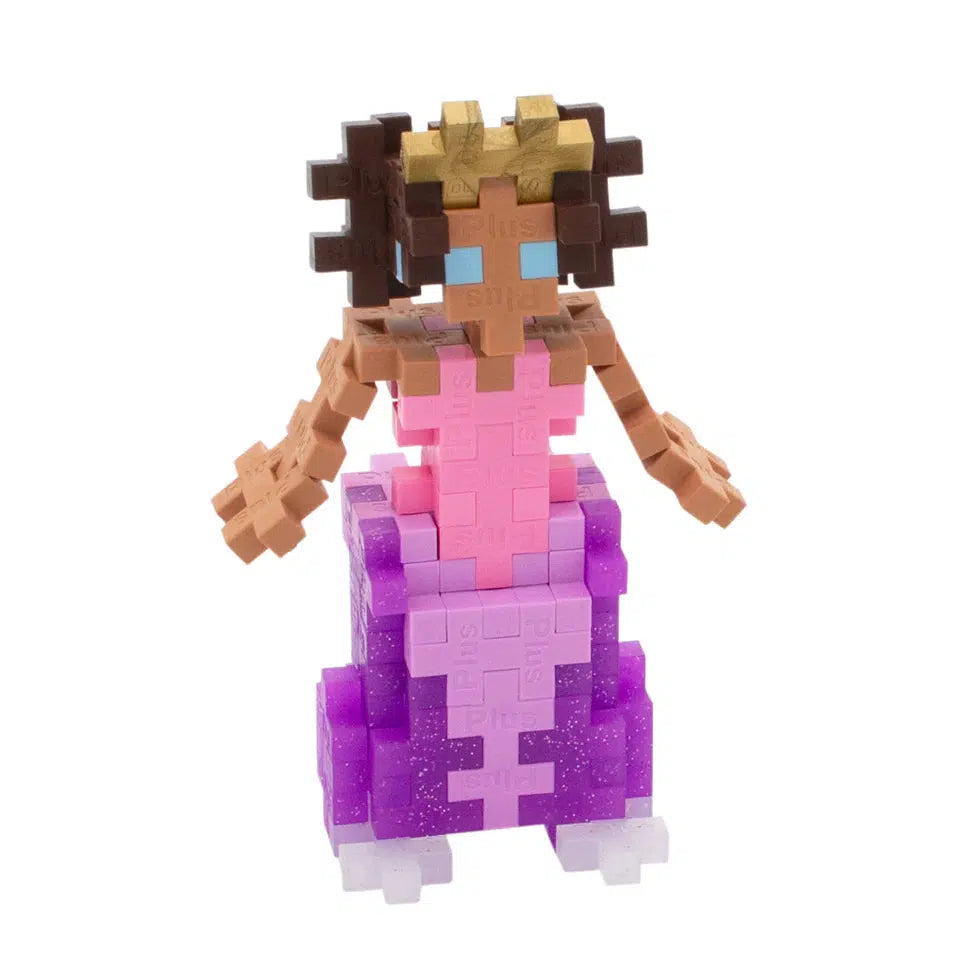 Princess toy with a pink and purple dress, and medium brown skin