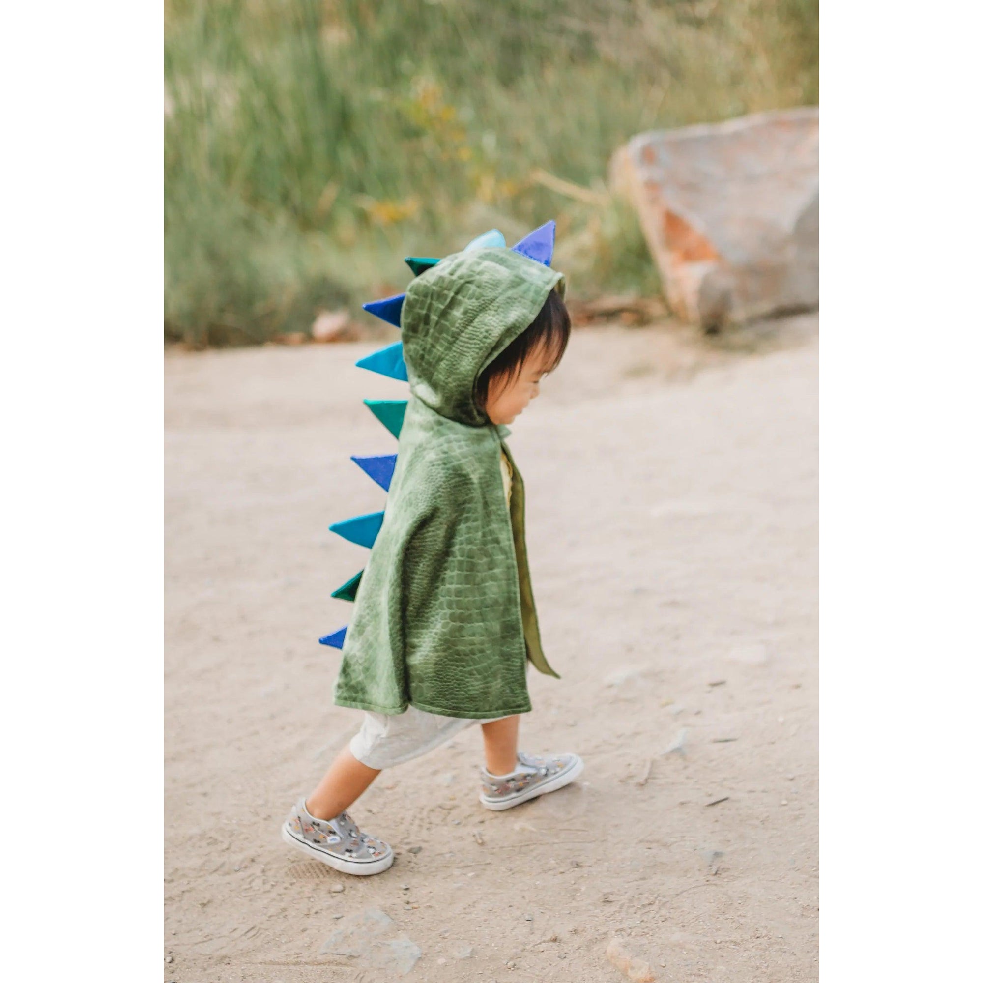 Baby dragon cape on child.