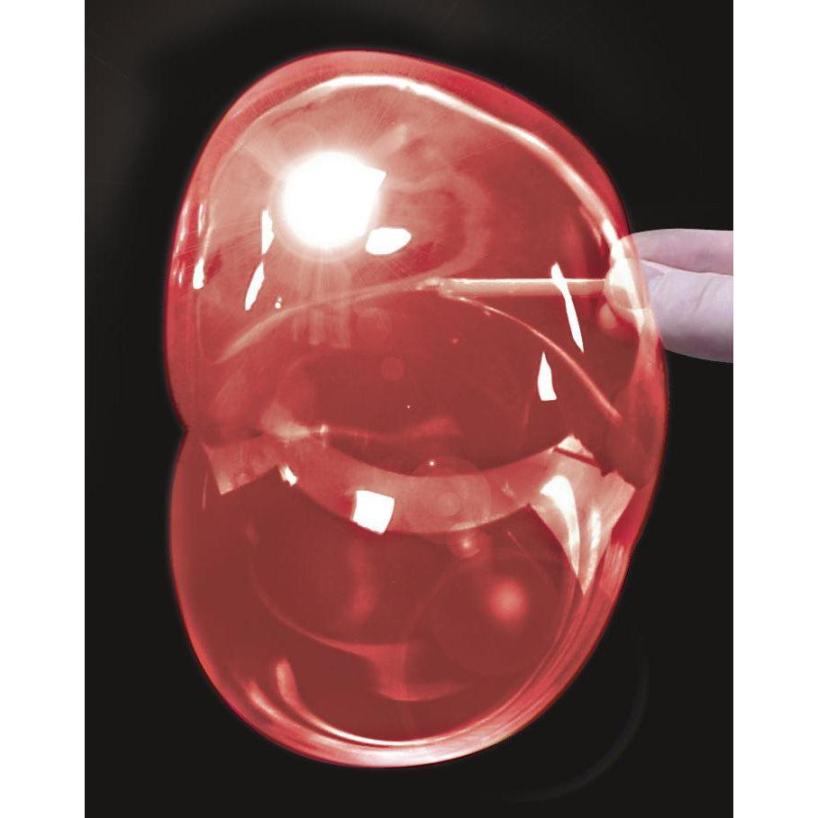 Front view of a hand holding a red plastic bubble.