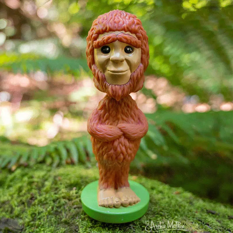 Front view of a Nodder Bigfoot posed out side with a grassy background.