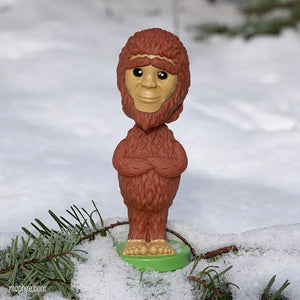 Front view of a Nodder Bigfoot posed outside with a snowy background.