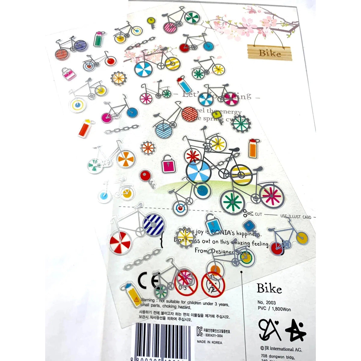 Rear view of package of Bike PVC Stickers with a sheet of the stickers laying across the package.