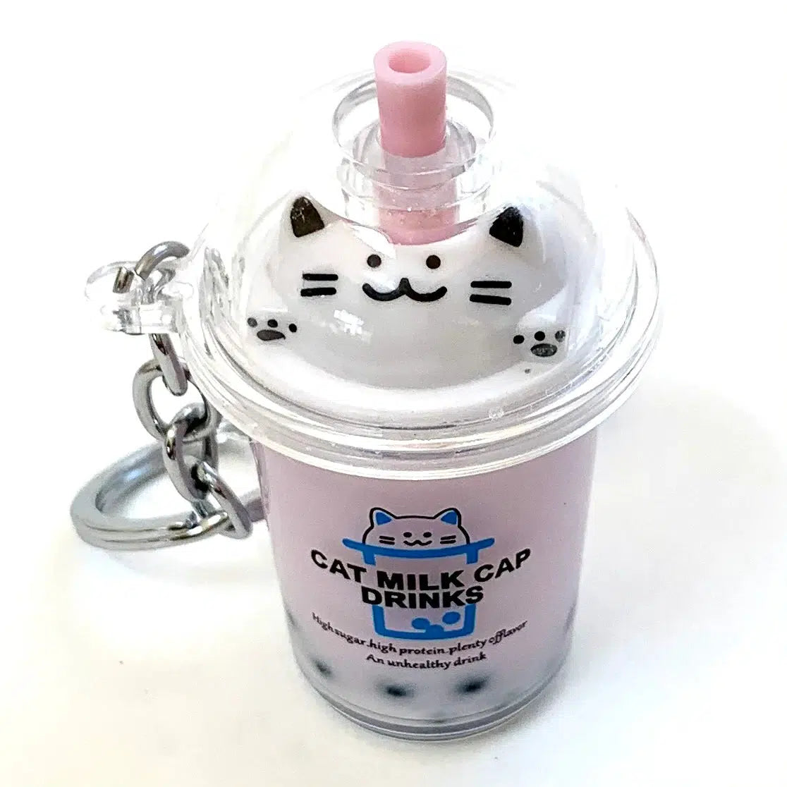 Front view of pale pink boba cat standing up.