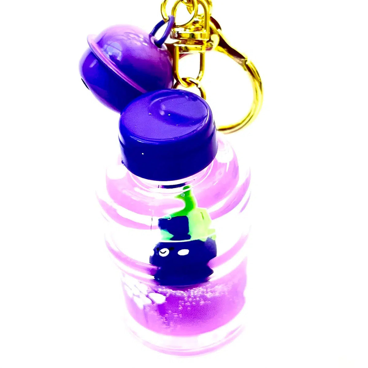 Front view of the bottle shaped Eggplant Floaty Key Charm showing the bell at the top of the keychain.