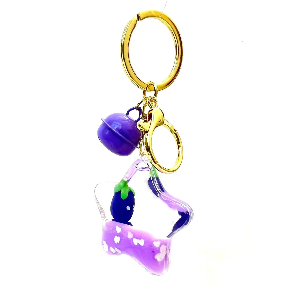 Front view of the star shaped Eggplant Floaty Key Charm showing the bell at the top of the keychain.