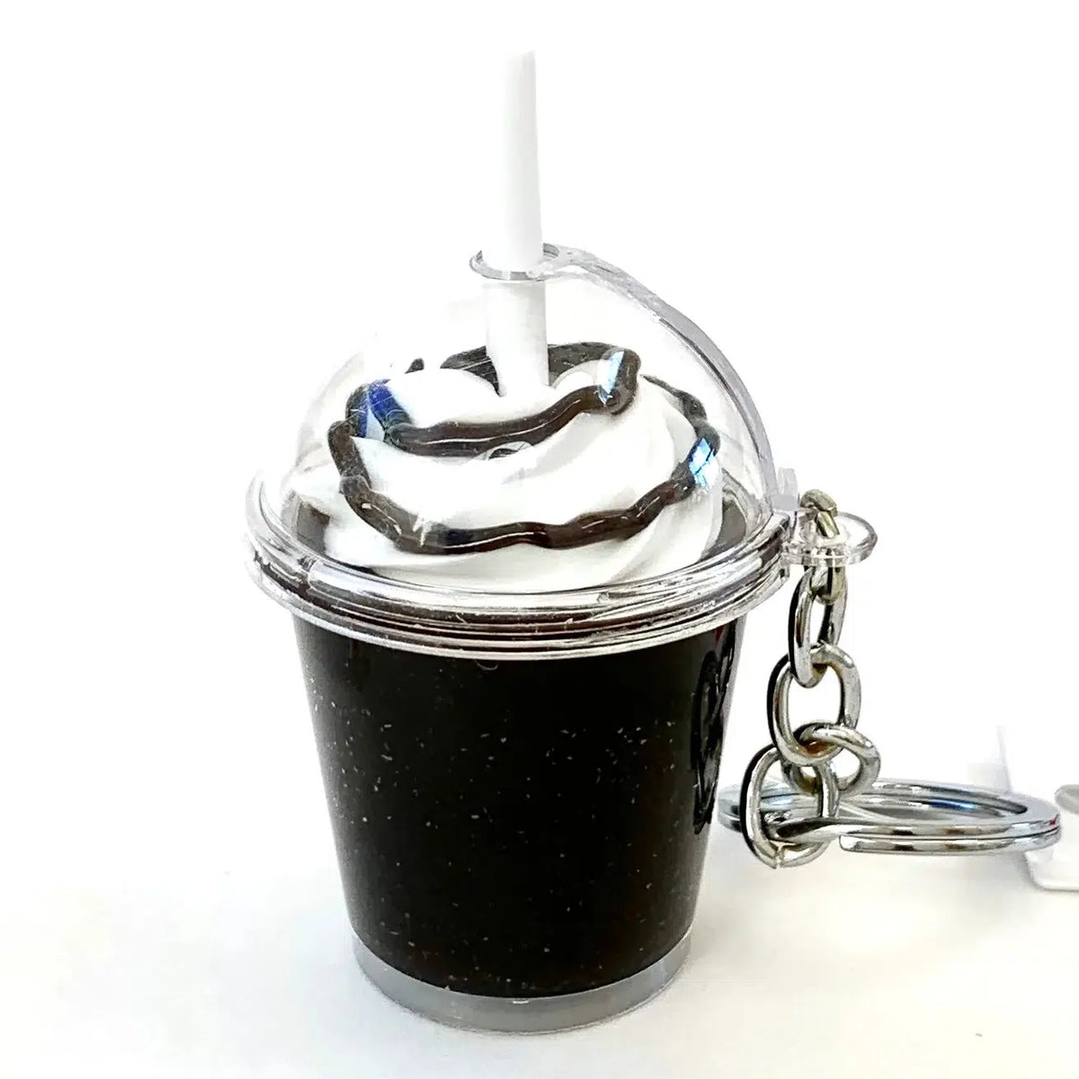 Front view of dark Iced Coffee Key Chain standing up.