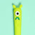 Front view of neon green one-eyed monster gel pen.