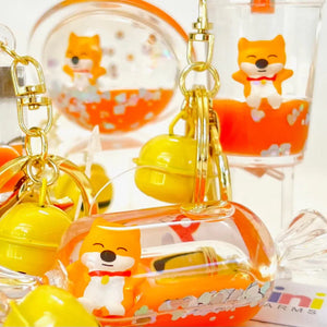 Close-up front view of multiple assorted styles of Shiba Inu key charms.