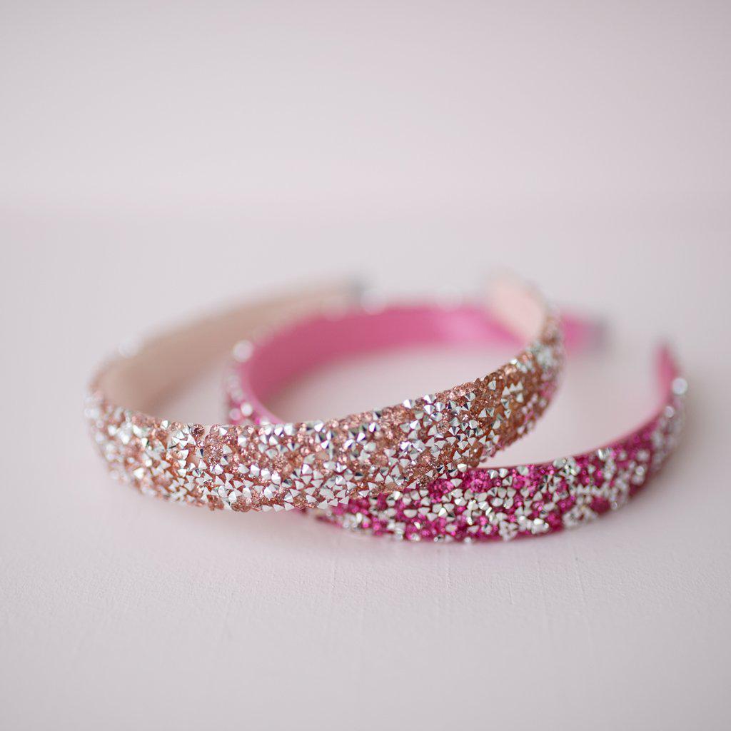 Boutique gummy glitter headbands in light and dark pink. 