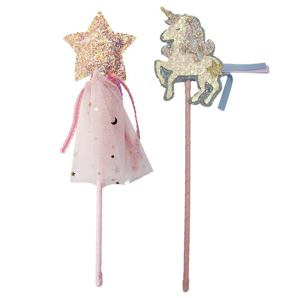 Boutique unicorn and star wands against a white background. 