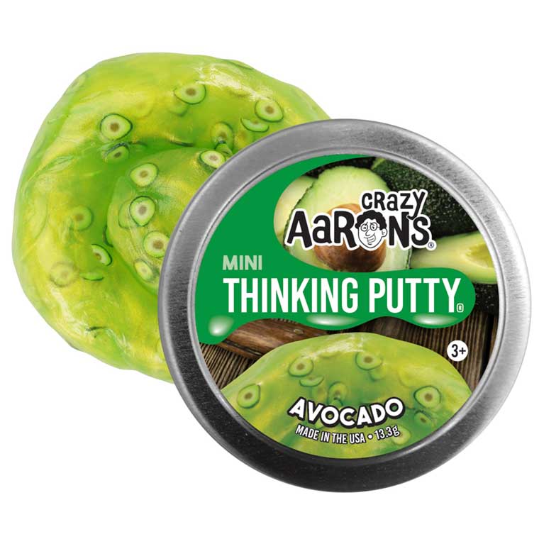 Front view of Crazy Aaron&#39;s Avocado 2 inch shown in packaging with putty outside showing avocado pieces in putty.
