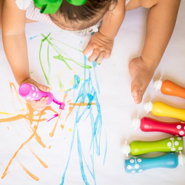 overhead view of a child using 6 Foam Markers for Little Hands. 
