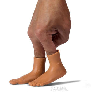 Front view of a darker skin tone hand and Finger Feet puppets showing on two fingers on the hand.