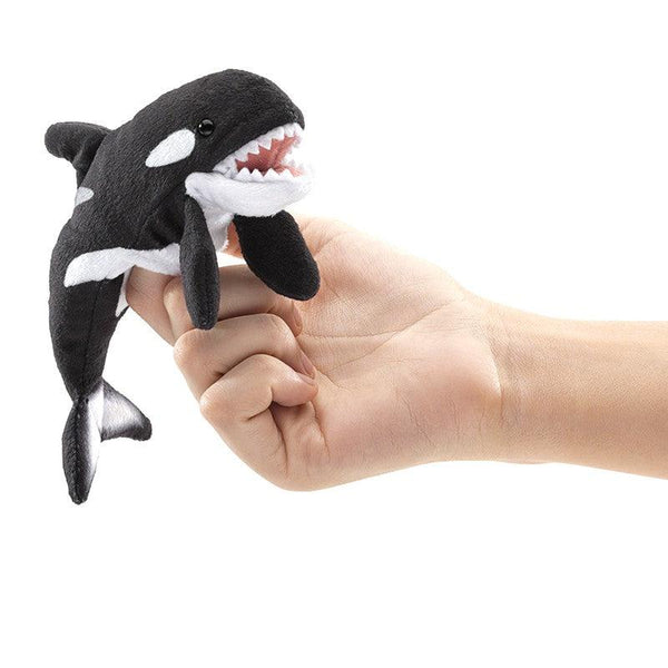 Mini Orca on someones finger with mouth open