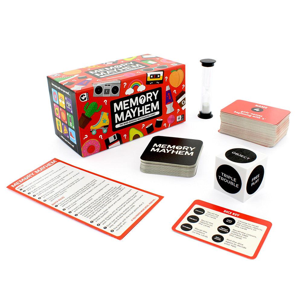 Front view of Memory mayhem with contents of game load out in front showing the time, die, match cards, die key, memory list,  and game play cards.