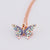 Front view of the Great Pretenders Butterfly Gem Necklace the charm up close.